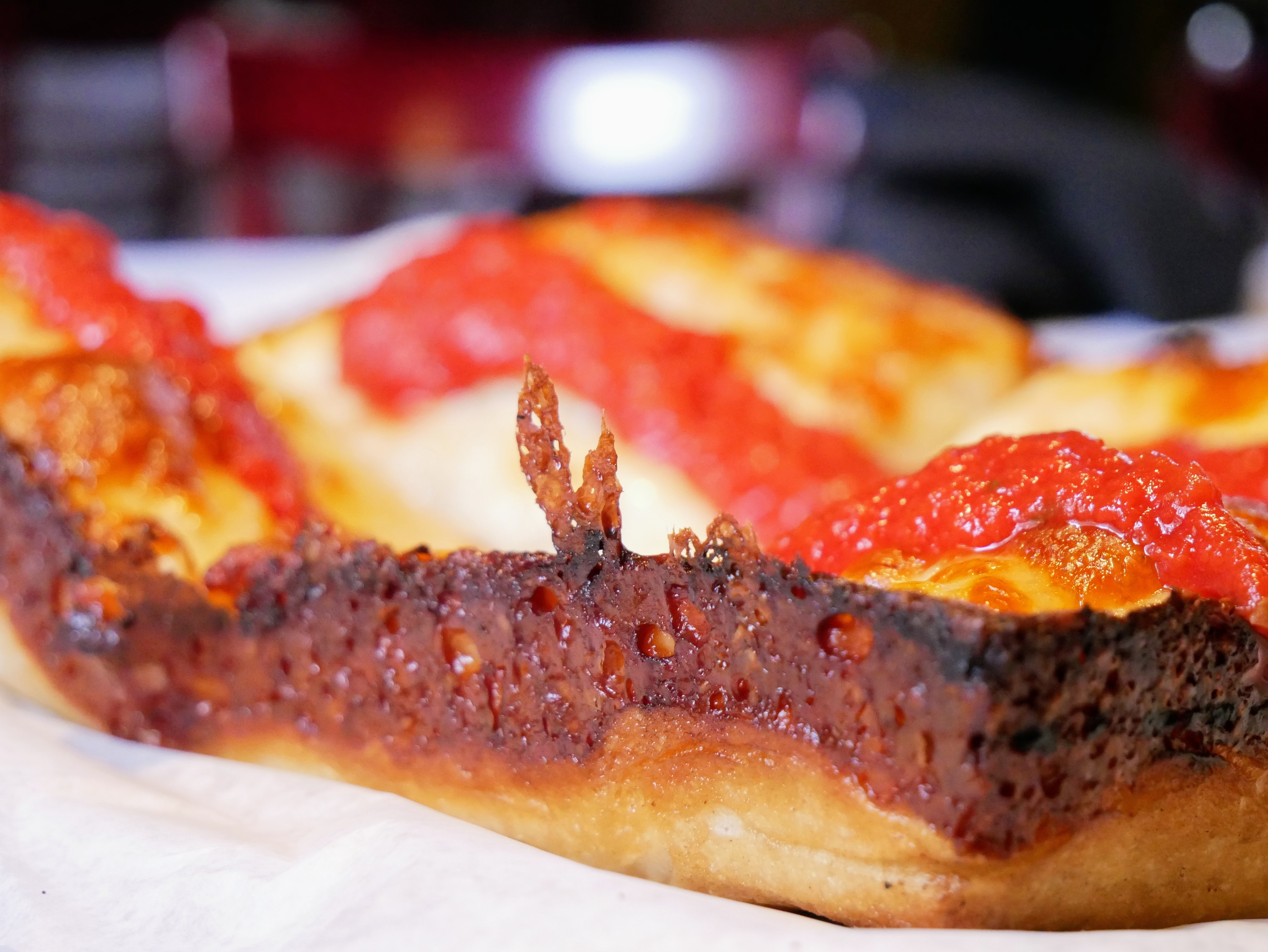 Hemi Pizza close-up showing the caramelized cheese edge crust